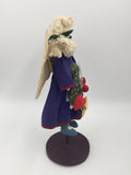 10572 - T - Angel Doll with Wood Base - Purple Dress with Floral Apron and Angel Wings - Box 39